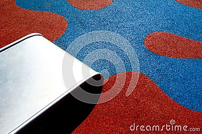 padded rubber sport and safety floor detail. playing area with red and blue flower pattern Stock Photo