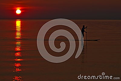 Paddleboarder / Paddle Boarding at Sunset Stock Photo