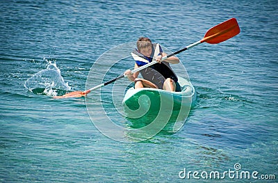 Paddling hard the kayak Stock Photo