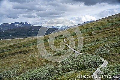 Padjelanta National Park with Wet Hiking Trail leading away from Camera Stock Photo