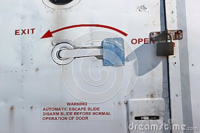 Padlock on aircraft door Stock Photo