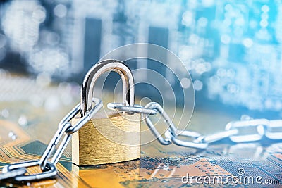 Padlock with chain on electronic printed circuit board. IT, internet protection, computer safety. Network Security, data security Stock Photo