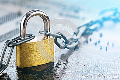 Padlock with chain on electronic printed circuit board. IT, internet protection, computer safety. Network Security, data security Stock Photo