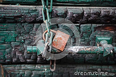 Padlock and chain on wooden entrance door, Traditional house facade, old town of Plaka, Athens Greece Stock Photo