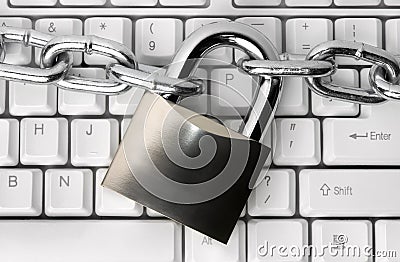 Padlock on a computer keyboard Stock Photo