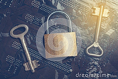 Padlock on computer motherboard with vintage keys. Internet data privacy information security encryption concept Stock Photo