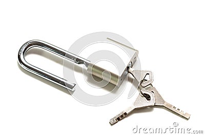 A padlock with elongated hook latch bar and three keys against a white backdrop Stock Photo