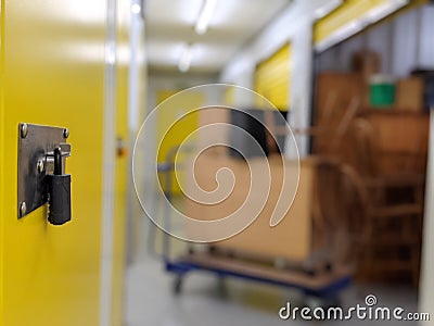 A padlocked self storage unit door ready for clearing Stock Photo