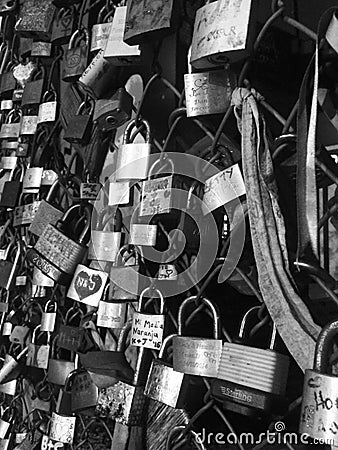 Padlocks on a wire fence, Shoreditch, London Editorial Stock Photo