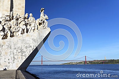 The Padrao dos Descobrimentos and The 25 de Abril Bridge over Tagus river, Lisbon. . Editorial Stock Photo