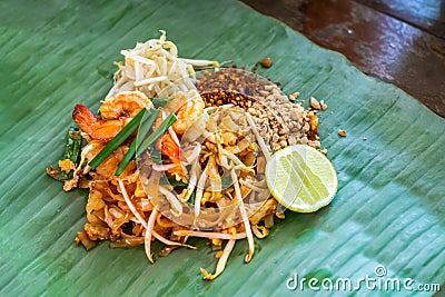 PadThai, The Traditional of Thailand Fried noodle with prawns on the banana leaf ready to serve for lunch Stock Photo