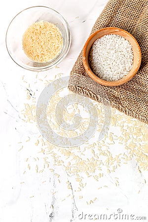 Paella ingredients with rice on white table background top view mock up Stock Photo