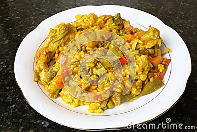 Paella of rice with chicken and vegetables