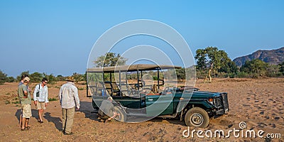 Game drive vehicle stuck in dry river sand Editorial Stock Photo