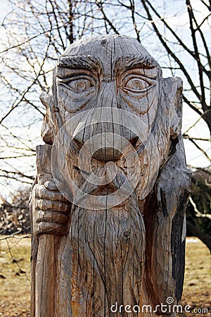 Pagan wooden statue of an old man. Editorial Stock Photo