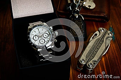 2021-06-03 Pagani Design Chronograph Sport Wrist Watch, Homage Wrist Watch of the Rolex Cosmograph Daytona in the Box on the Wood Editorial Stock Photo