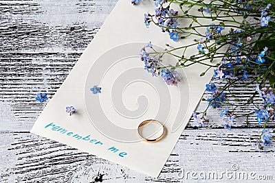 Page of a notebook, there is a bouquet of forget-me-nots on it a Stock Photo