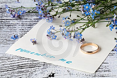 Page of a notebook, there is a bouquet of forget-me-nots on it a Stock Photo