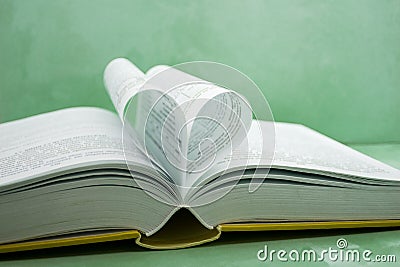 Pages of a book curved into a heart shape Stock Photo