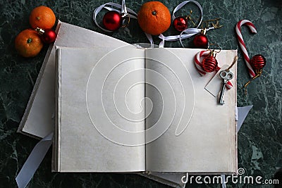 Pages opened vintage book on green marble countertop Stock Photo