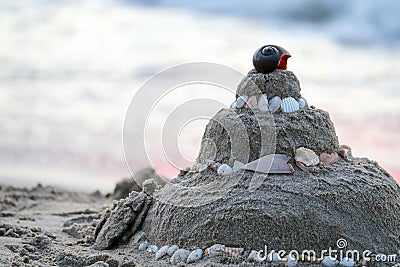 Pagoda sand on the beach is the culture has instilled Buddhist religion in children, by play through the sand formation Stock Photo