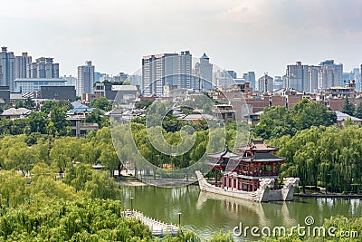 Pagoda on a stone boat with dragon sculptures aerial view in Xi`an Tang paradise park Editorial Stock Photo