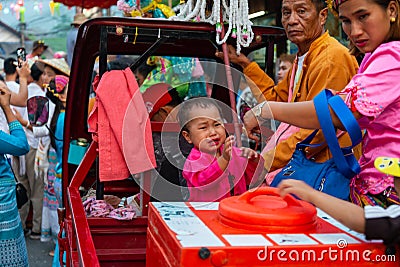 Small child crying at Hoy Sang Long celebrations,Northern Thailand Editorial Stock Photo