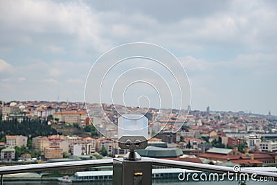 Paid binoculars on the observation deck on the background of the city Stock Photo