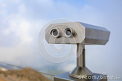 Paid binoculars for tourists in a resort place. Copy space background Stock Photo