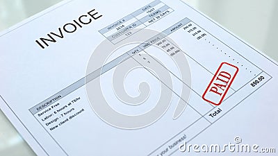 Paid seal stamped on invoice document, business bills, accountancy expense Stock Photo