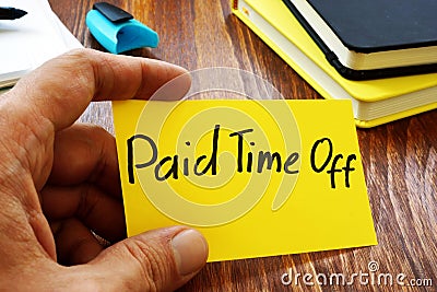 Paid time off pto sign on a memo stick Stock Photo