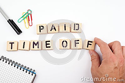 Paid time off. Wooden letters on a white background Stock Photo