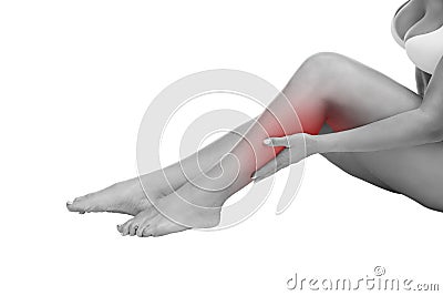 Pain in the calf muscle of the woman, massage of female feet, ache in the human body on white background Stock Photo