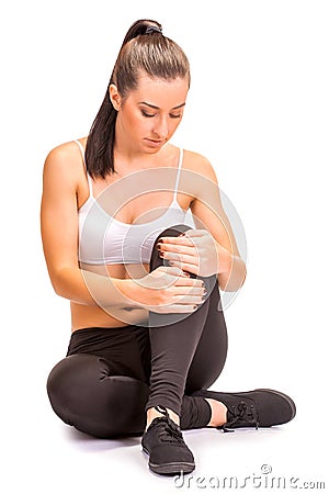 Pain. girl holds knee in his hands. isolated Stock Photo