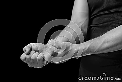 Pain in a male wrist, monochrome image Stock Photo