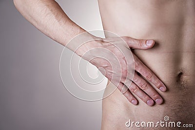 Pain in the right side. Attack of appendicitis Stock Photo