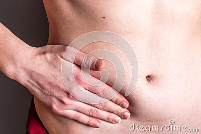 Pain in the right side. Attack of appendicitis. Stock Photo