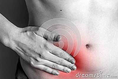 Pain in the right side. Attack of appendicitis. Stock Photo
