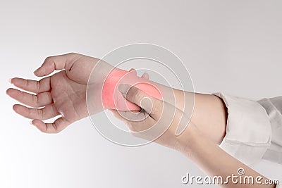 A pain in the woman`s wrist isolated on white background Stock Photo