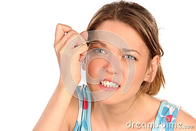 Painful eyebrow plucking Stock Photo