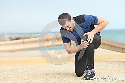 Runner complaining suffering knee ache after sport Stock Photo