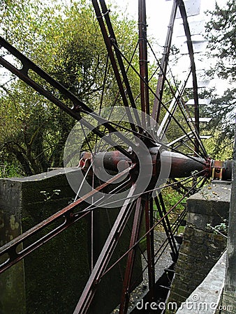 Painshill Metal water wheel, very large from England Stock Photo