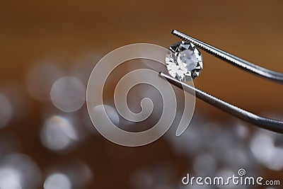 Painstaking jewelry work, looking at diamond. Stock Photo