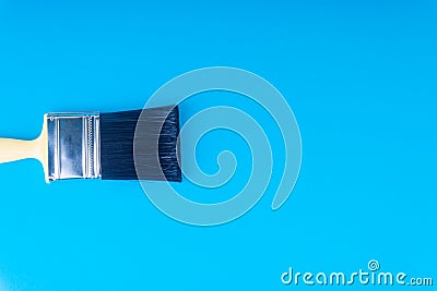 Paint brush on blue colour background Stock Photo