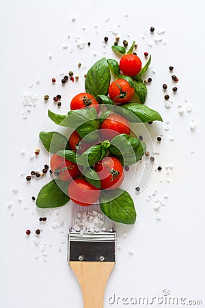 Paint brush and dab of ketchup ingredients for cooking sauce: tomato, basil, pepper, salt. Food art concept. Stock Photo