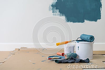 Paint bucket with roller, glove and brush Stock Photo