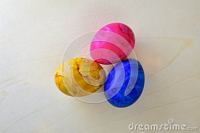 Paint colored easter eggs on wood structure background. View from above Stock Photo