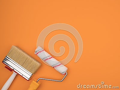 A paint roller and a large brush on an orange background Stock Photo