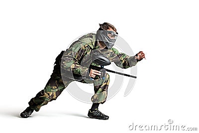 Paintball player in action isolated Stock Photo