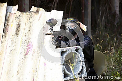 Paintball player holding position Stock Photo